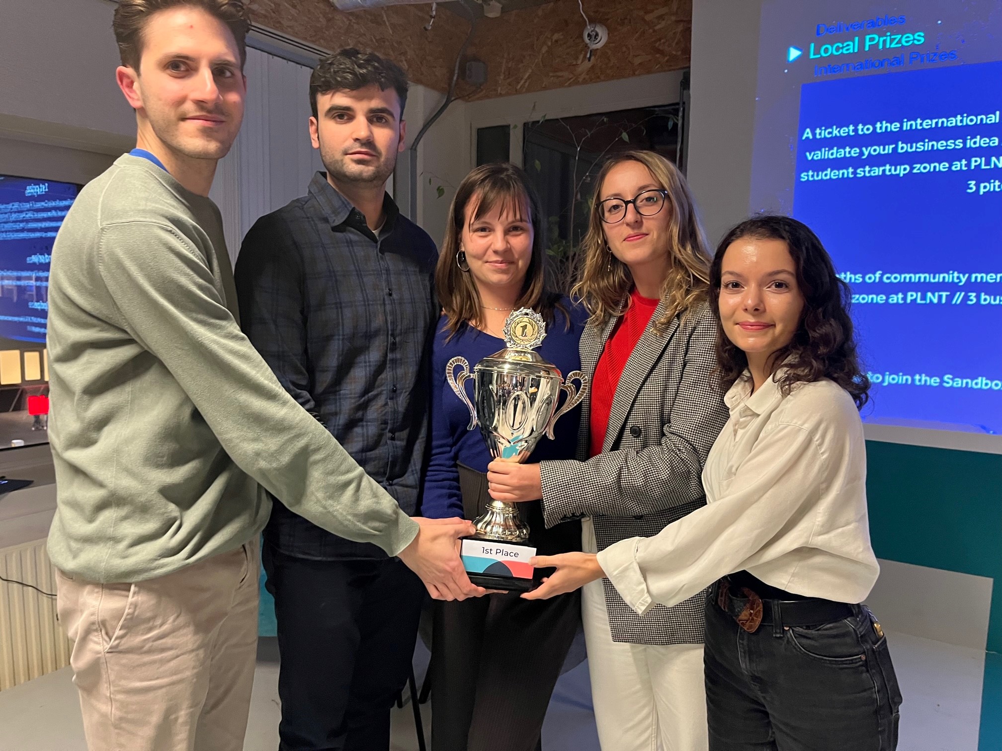 Ecosmic team with trophy, winners of the Dutch heat of ActInSpace 2022