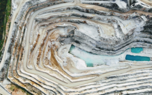 aerial view of a quarry with a blue pool
