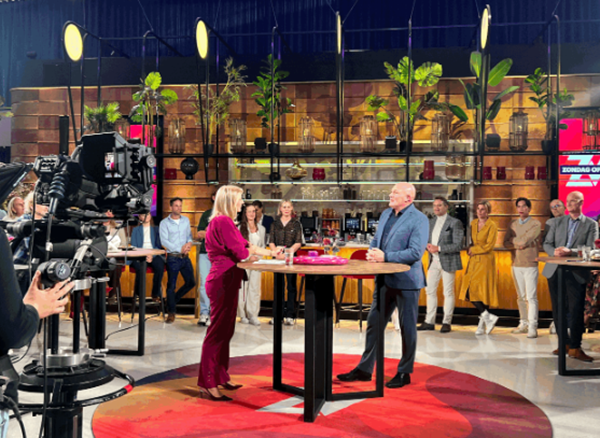 space professional interviewed in TV studio