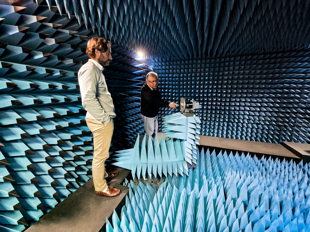 space business professionals inside anechoic chamber