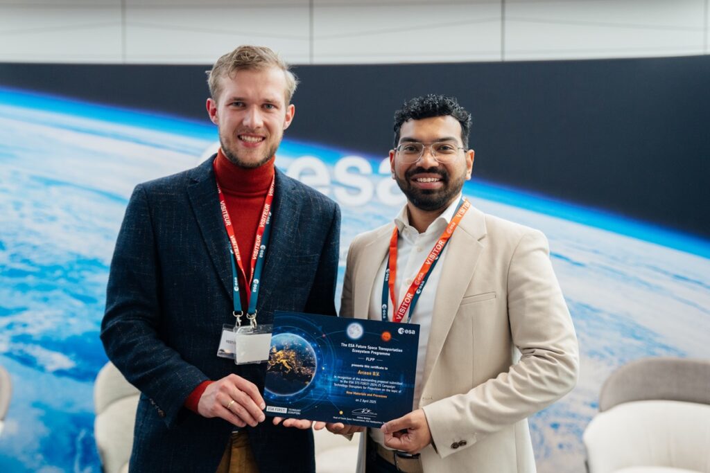 space business professionals on stage at ESA HQ with award certificate