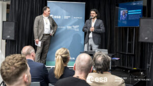 space business professionals presenting on stage