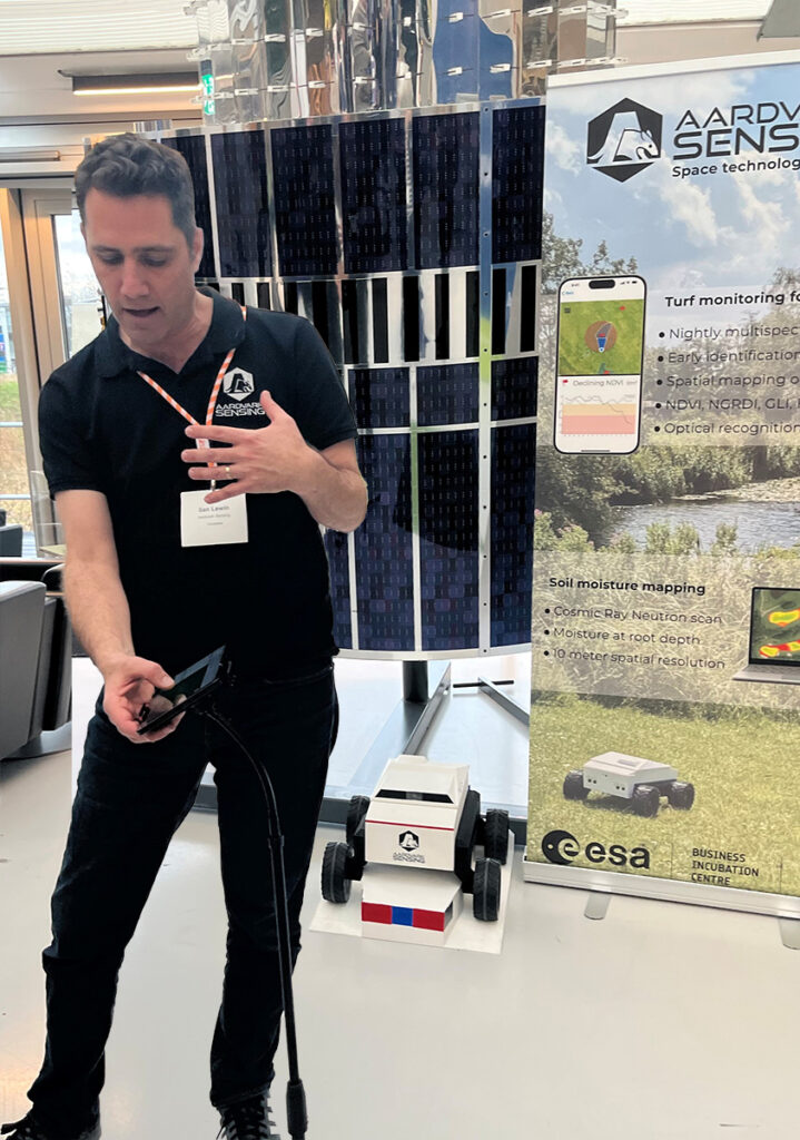 space business professional by the satellite at SBIC Noordwijk