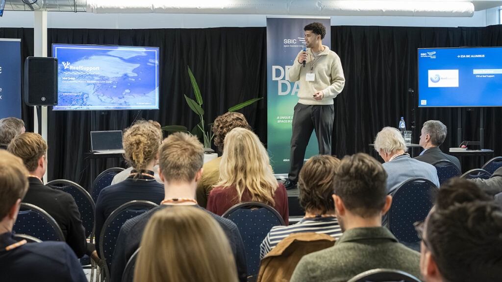 space business professional on stage at SBIC Noordwijk