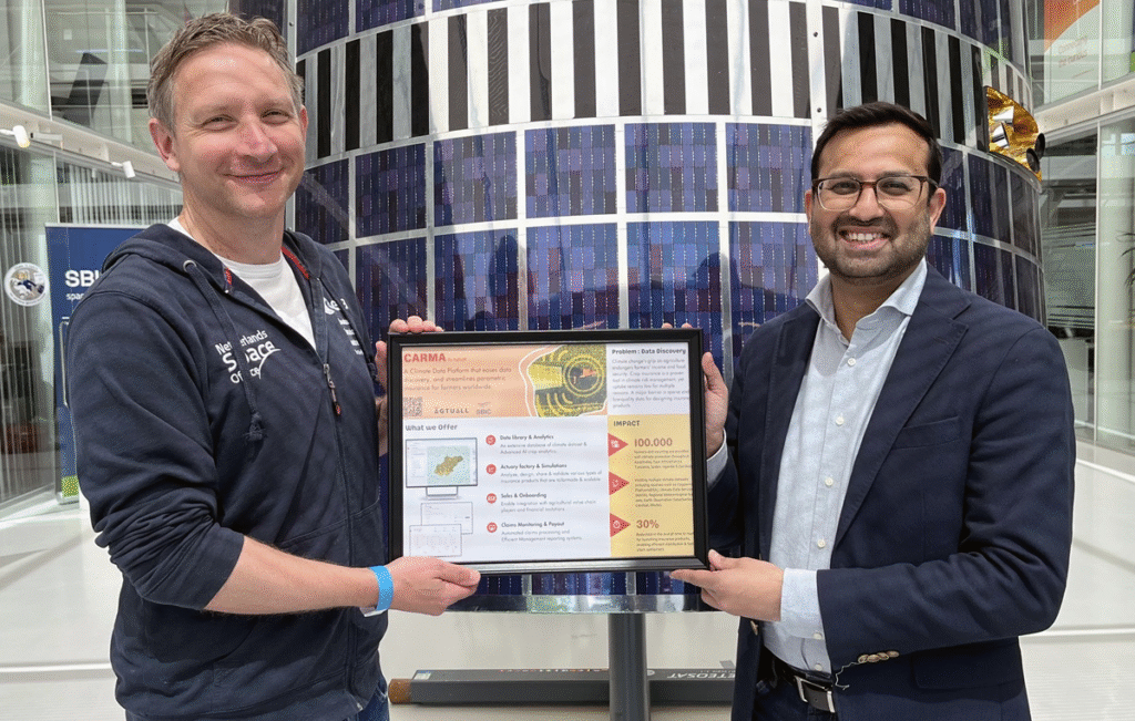 space business professionals by the satellite at SBIC