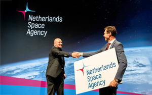 space business professionals on stage at space symposium launching new identity