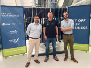 space business professionals by the satellite at SBIC Noordwijk