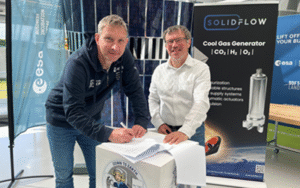 space business professionals stood by the satellite at SBIC Noordwijk