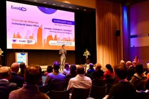 space business professional on stage during presentation