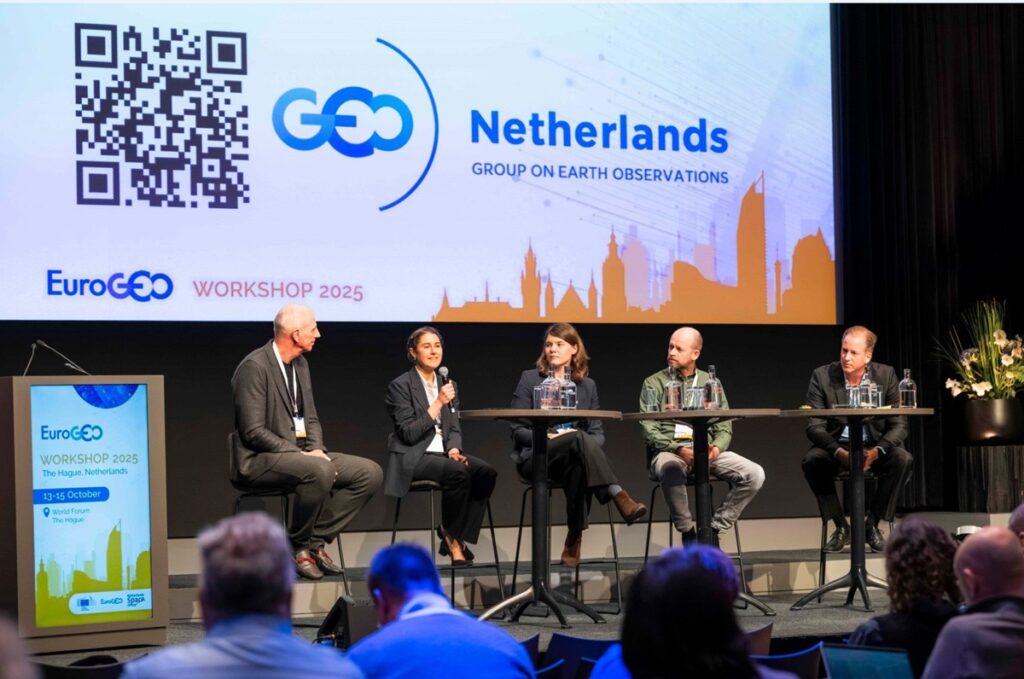 space business professionals on stage during event panel discussion