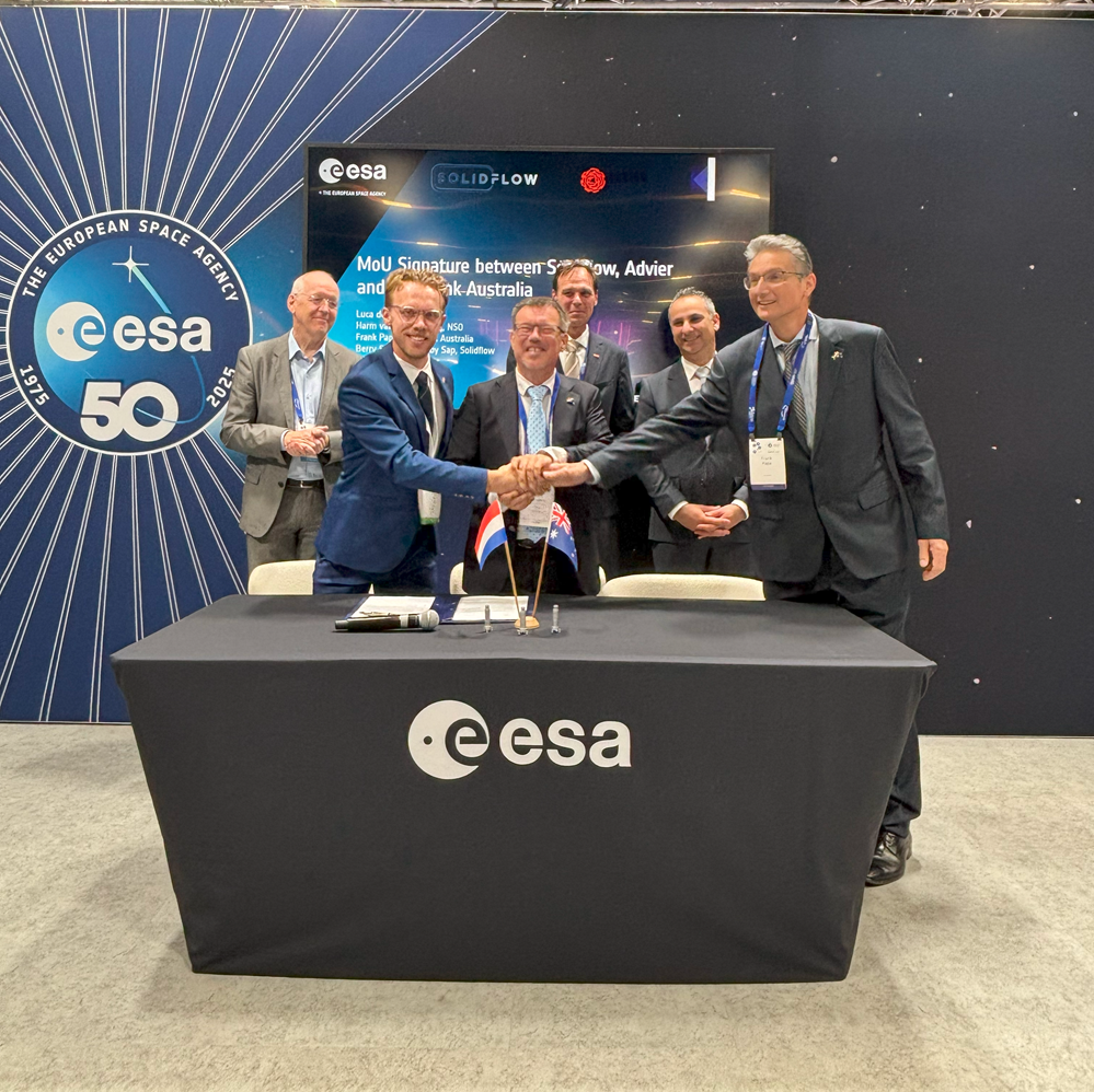 space business professionals in a signing moment