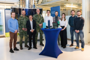 space business and military professionals stood by the satellite at SBIC Noordwijk